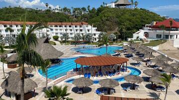 Outdoor pool, open 9:00 AM to 7:00 PM, pool umbrellas