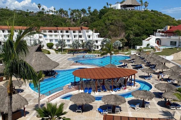 Outdoor pool, open 9:00 AM to 7:00 PM, pool umbrellas
