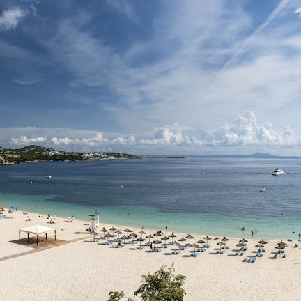 On the beach, white sand, beach towels