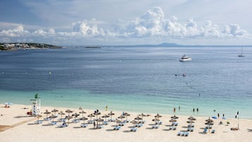 On the beach, white sand, beach towels