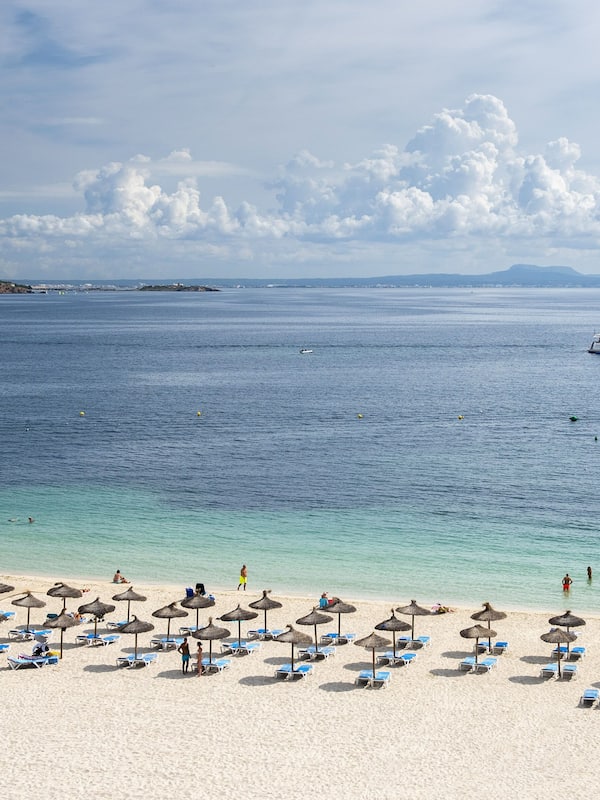 On the beach, white sand, beach towels