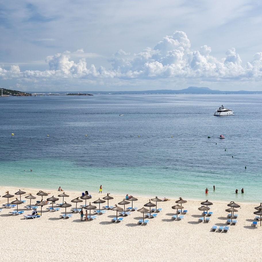 On the beach, white sand, beach towels