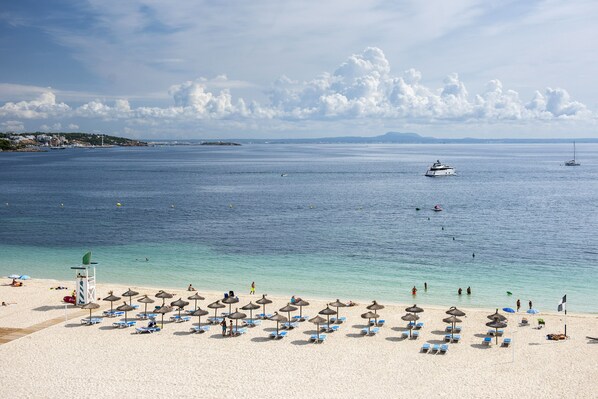 On the beach, white sand, beach towels