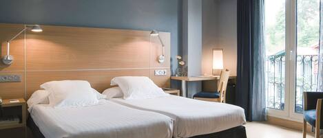 Premium bedding, down comforters, in-room safe, desk