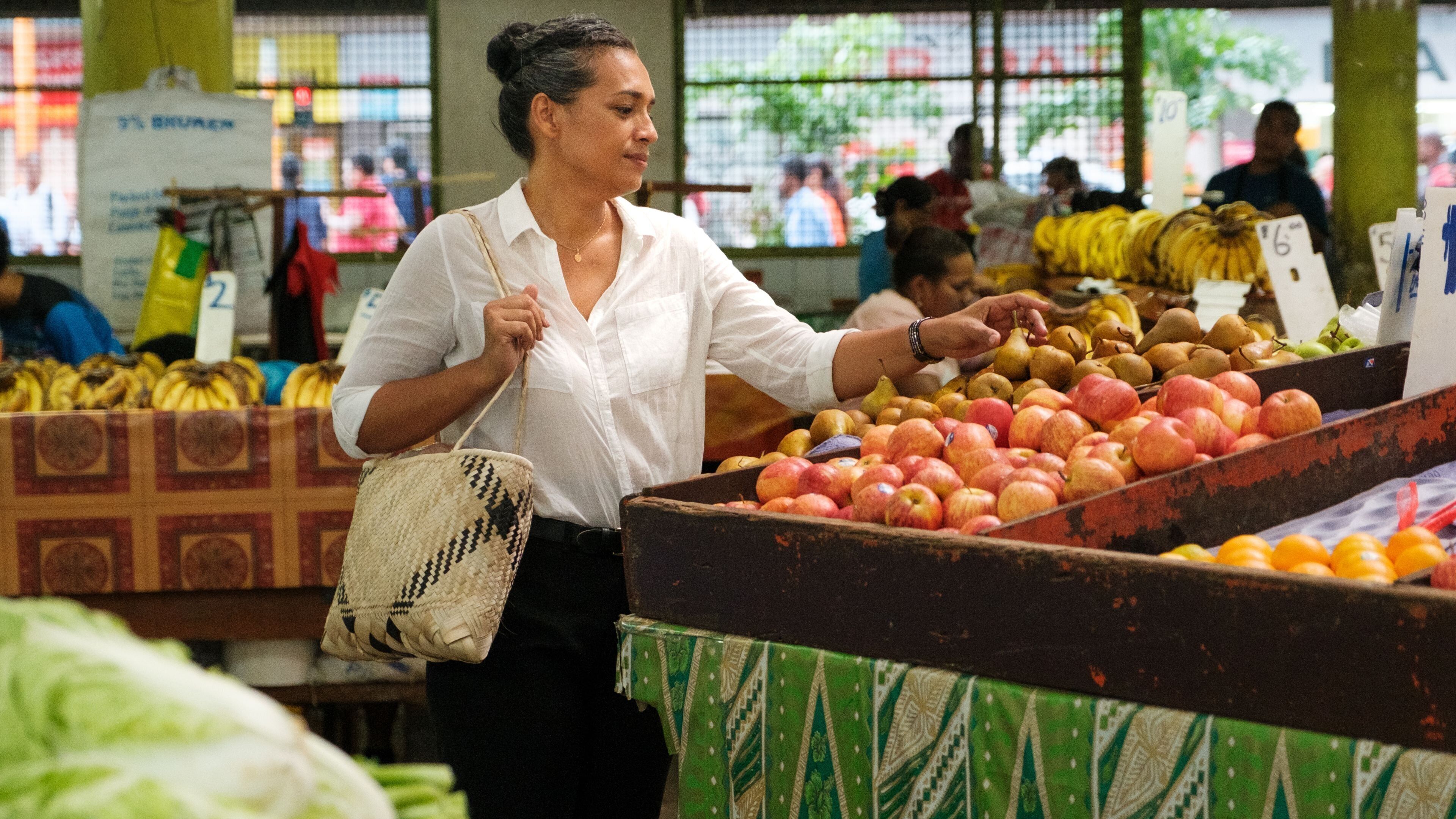 A market stall with various fruits and vegetables.