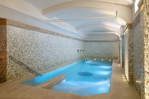 Indoor pool, open 7:00 AM to 9:00 PM, pool loungers