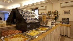 A buffet with various food items and a coffee station. - Galileo (Rome)