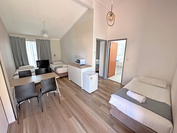 Family Suite, 1 Bedroom | Iron/ironing board, free WiFi, bed sheets