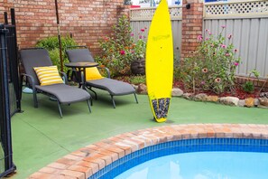 Outdoor pool, open 9:00 AM to 8:00 PM, pool umbrellas, pool loungers