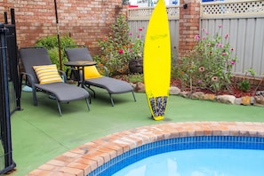 Outdoor pool, open 9:00 AM to 8:00 PM, pool umbrellas, pool loungers