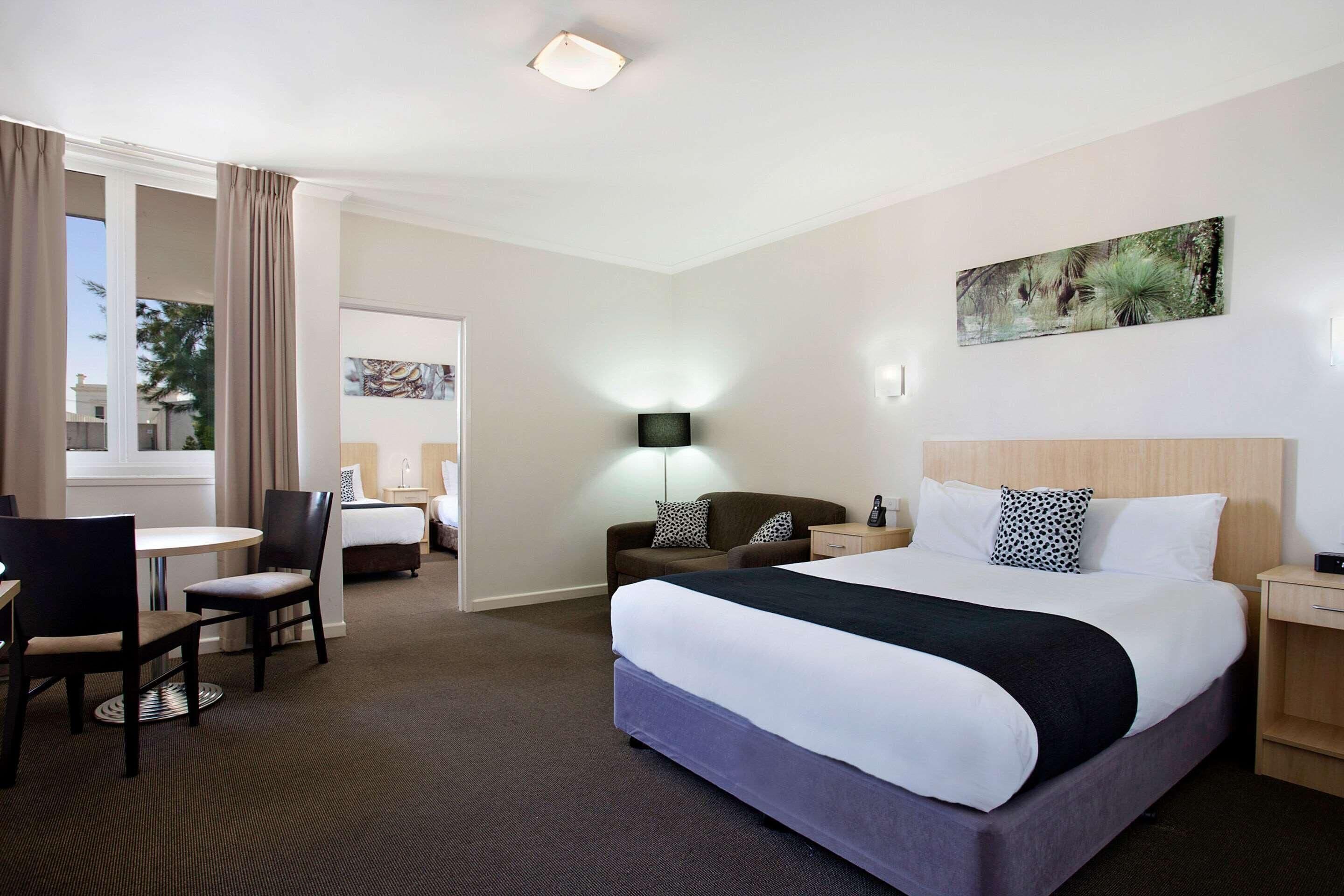 Family Room | Minibar, desk, blackout drapes, iron/ironing board