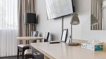 Minibar, desk, blackout curtains, iron/ironing board