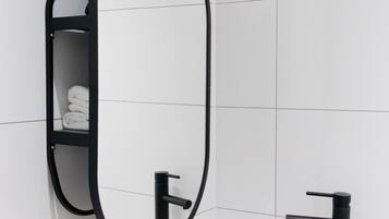 Shower, eco-friendly toiletries, hair dryer, towels