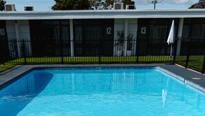 A swimming pool with a logo in the center. - m. hotel (Sale)