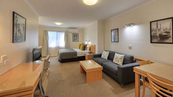 Suite, 1 Queen Bed, Non Smoking | Premium bedding, minibar, iron/ironing board, rollaway beds