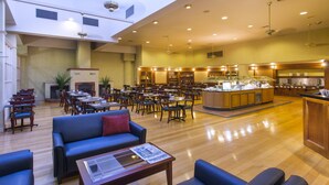 A spacious hotel lobby with a central bar area, multiple seating arrangements, and a fireplace. - Hotel Grand Chancellor Launceston (Launceston)