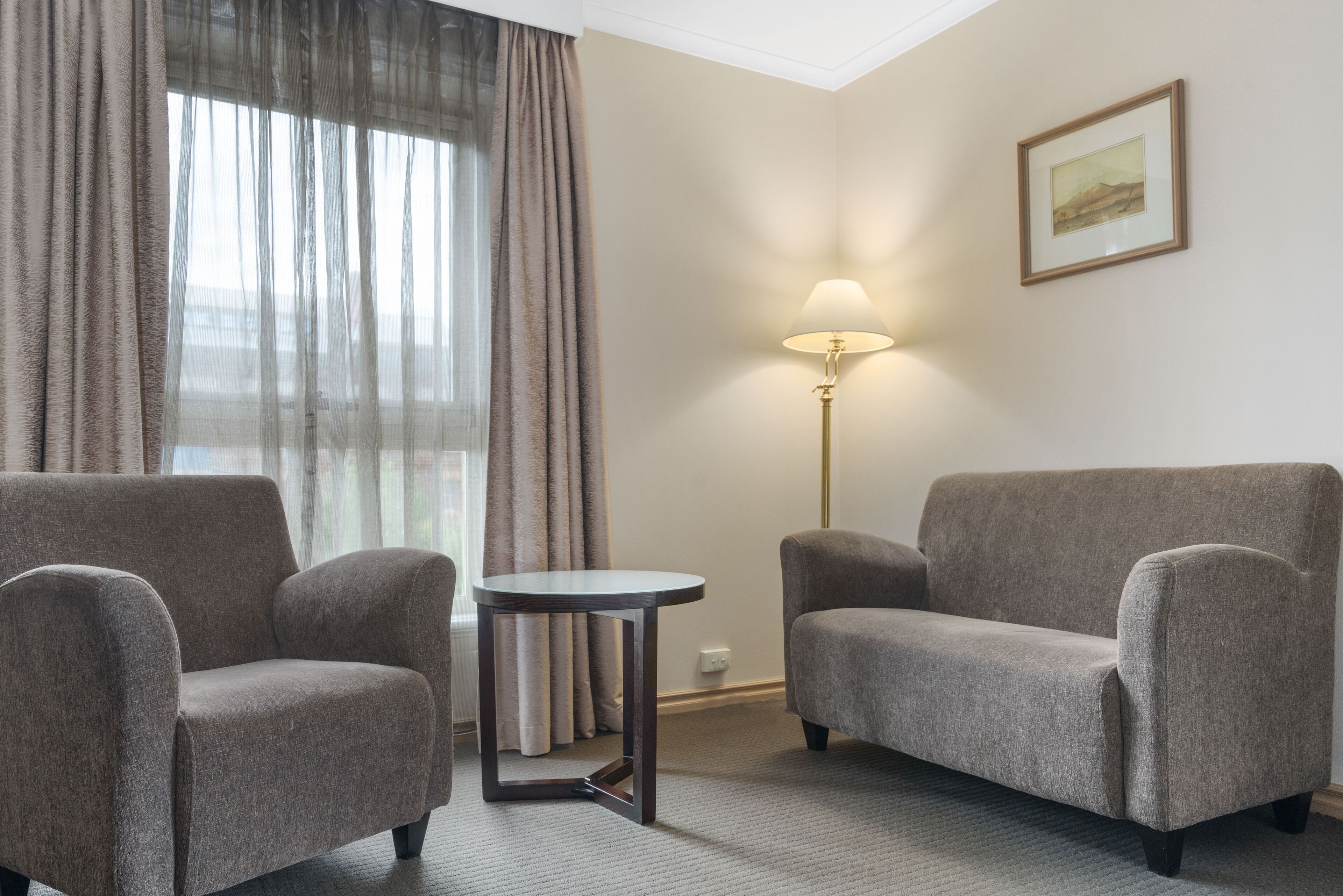 deluxe king room | living area | 50-inch led tv with digital channels, tv, netflix