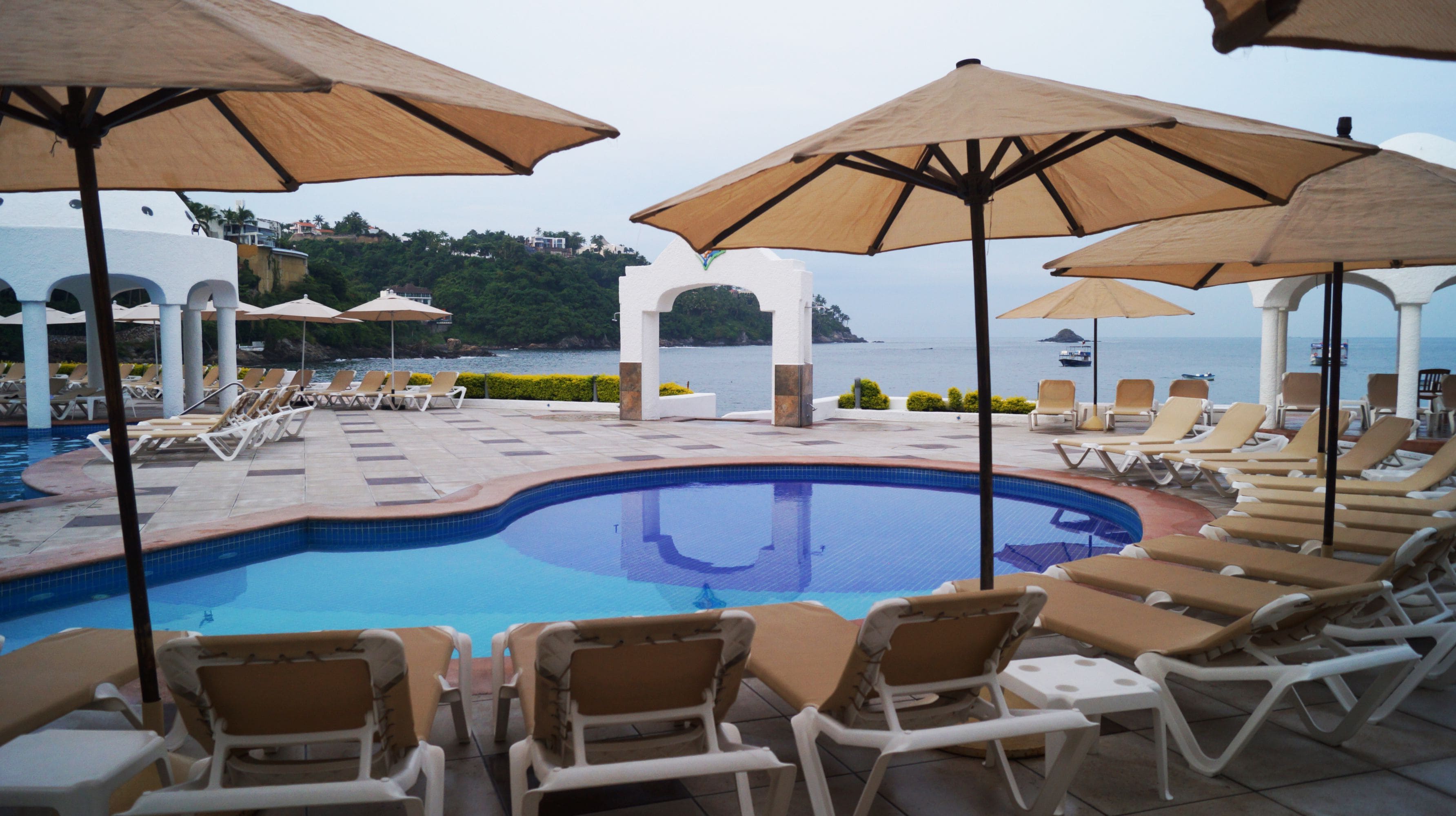 Outdoor pool, pool umbrellas, sun loungers