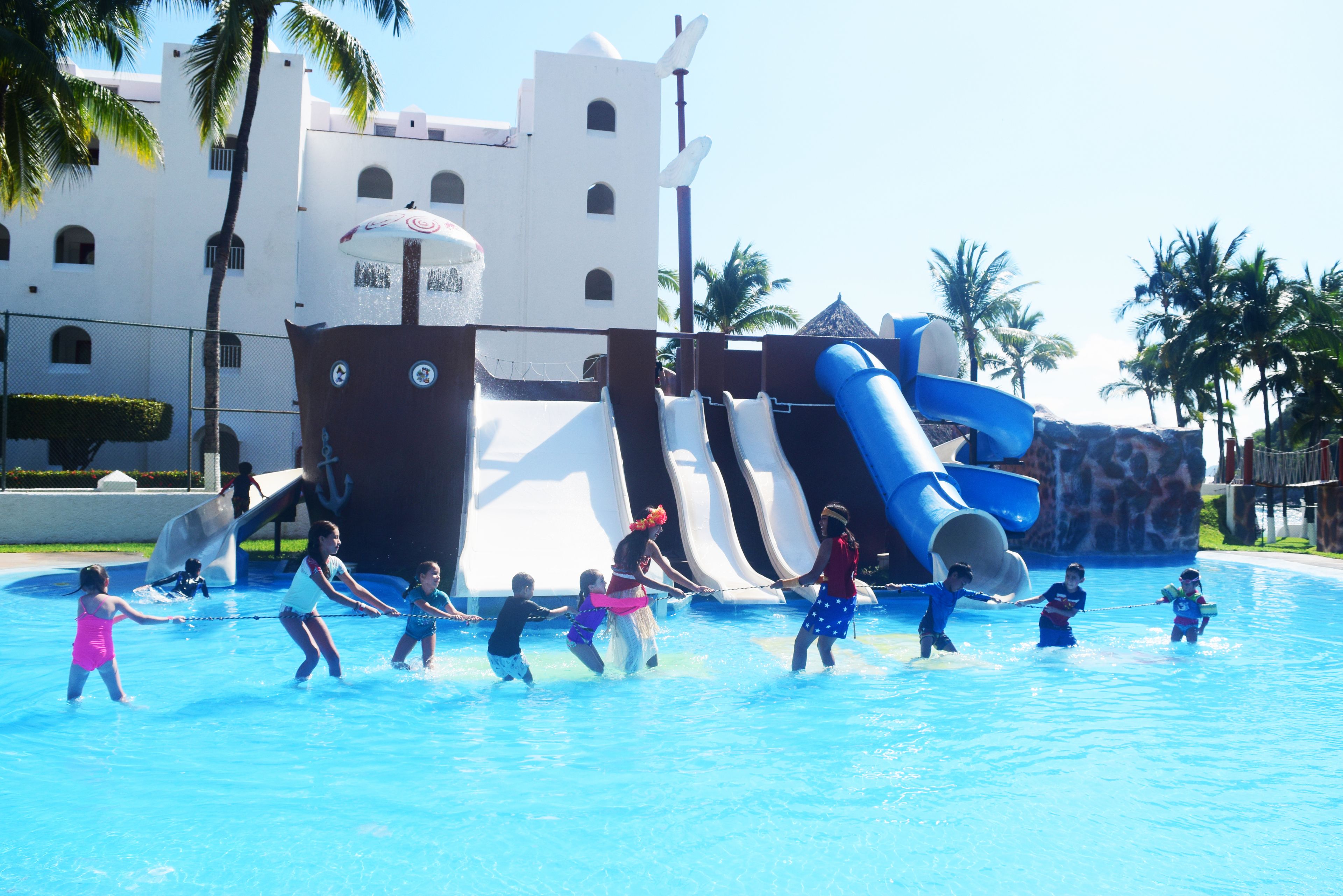 A water park with multiple slides and a large water slide structure.