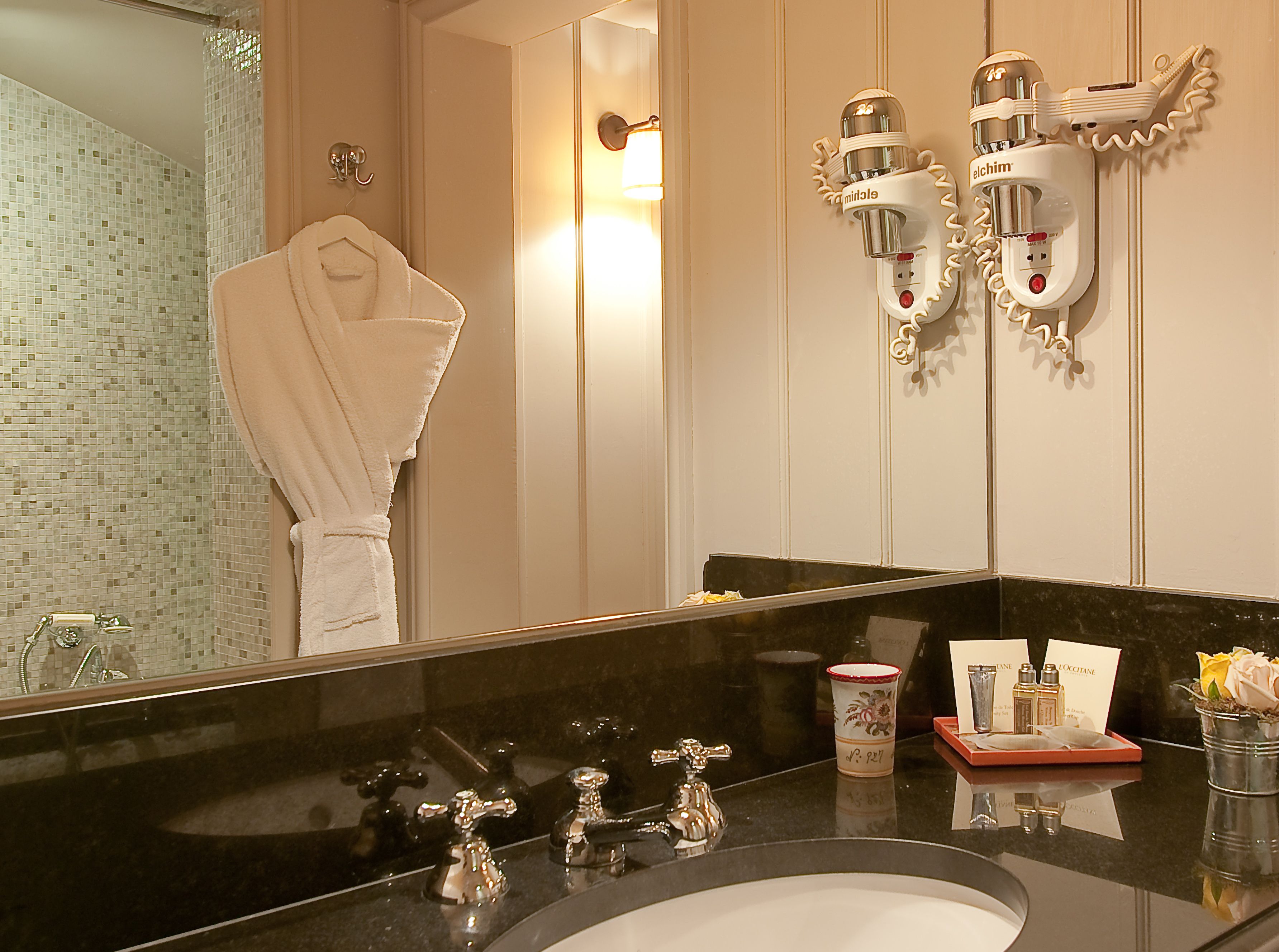 designer toiletries, hair dryer, bathrobes, towels