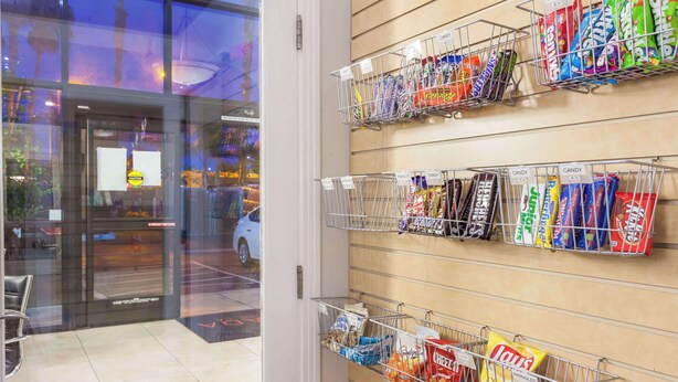 A candy display in a store with various brands and types of candy.
