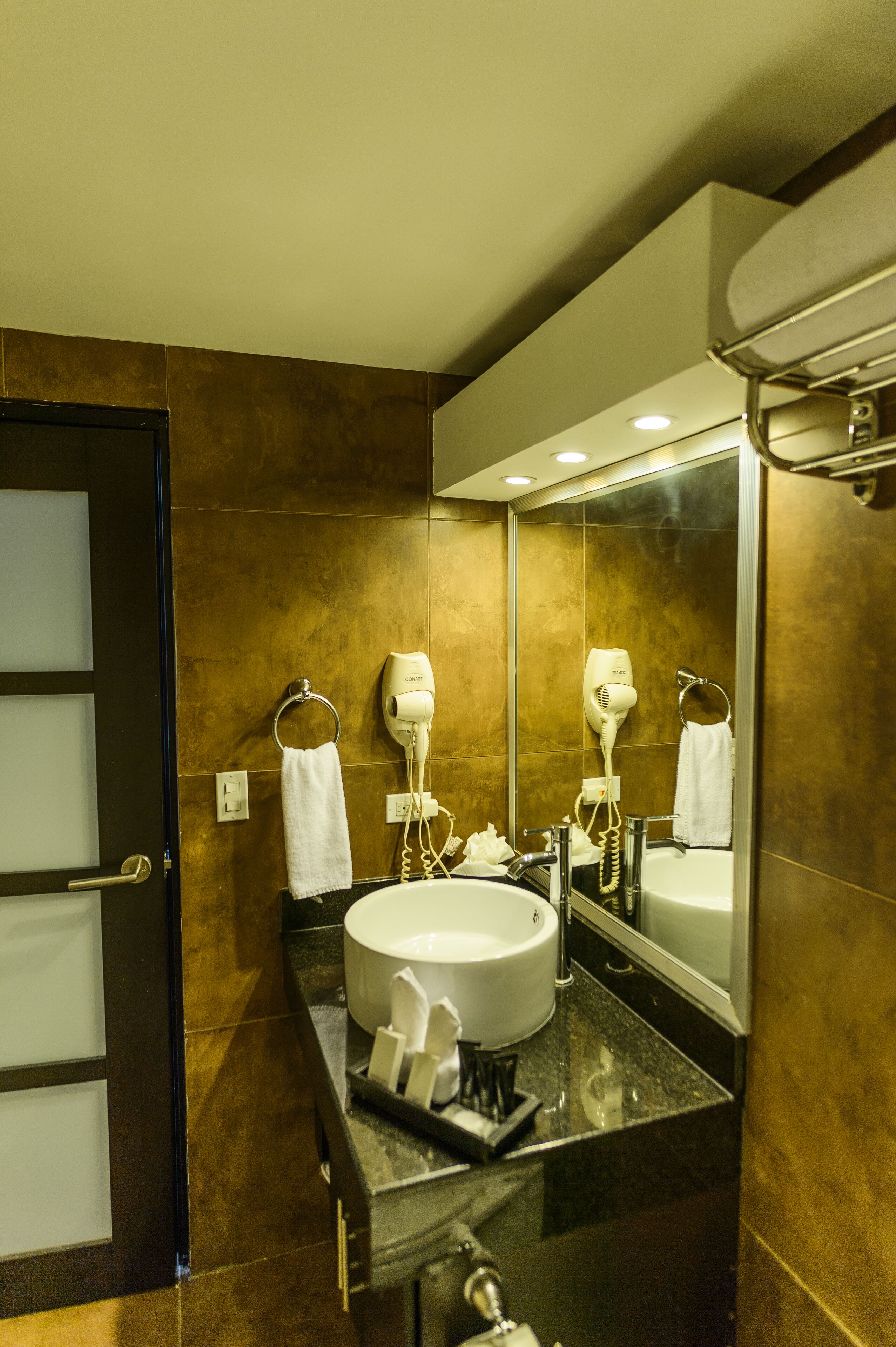 shower, designer toiletries, hair dryer, towels