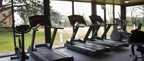 A gym with treadmills and exercise equipment.