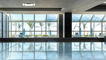 3 bars/lounges, poolside bar, beach bar