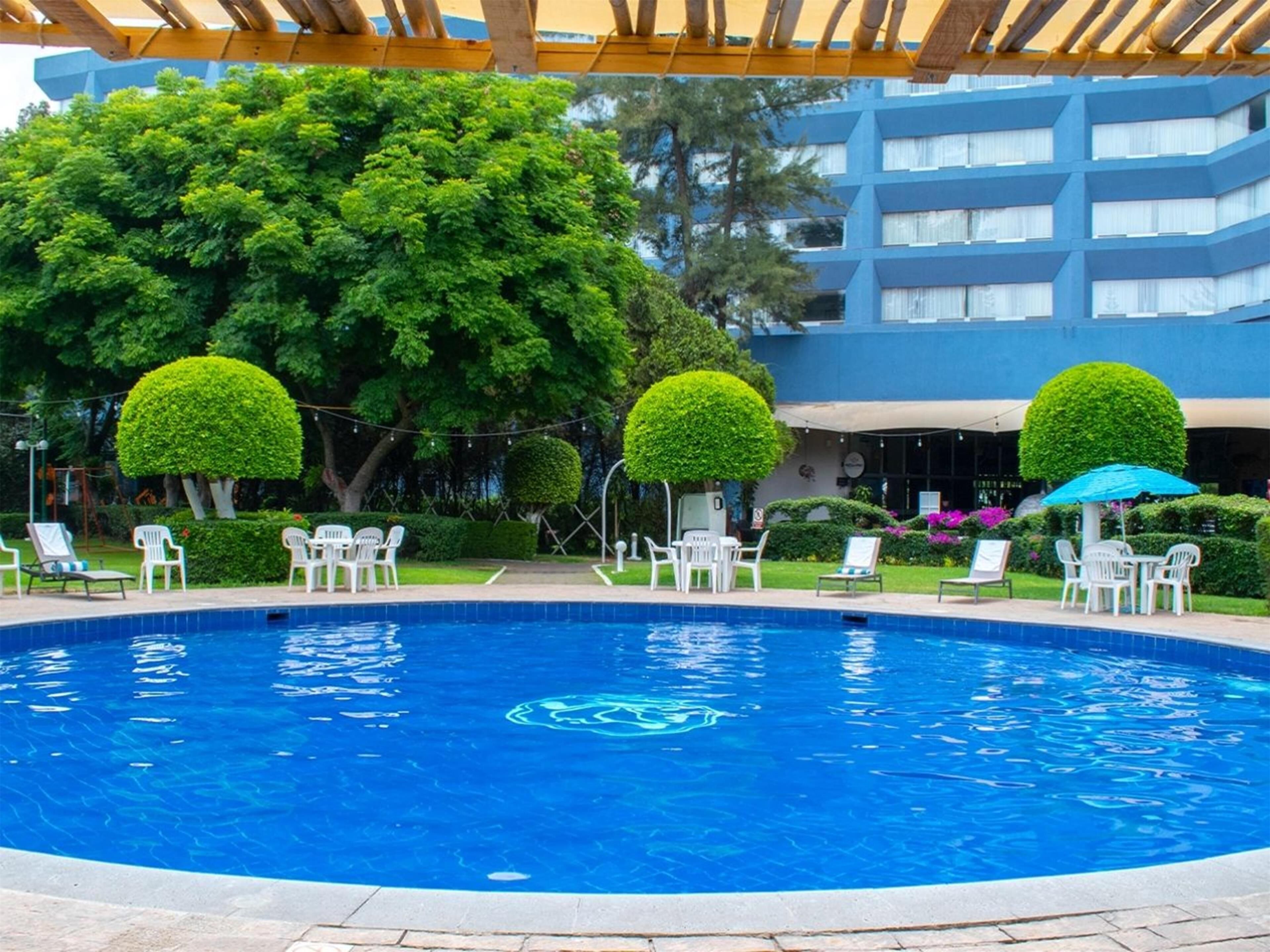 outdoor pool, pool umbrellas, pool loungers