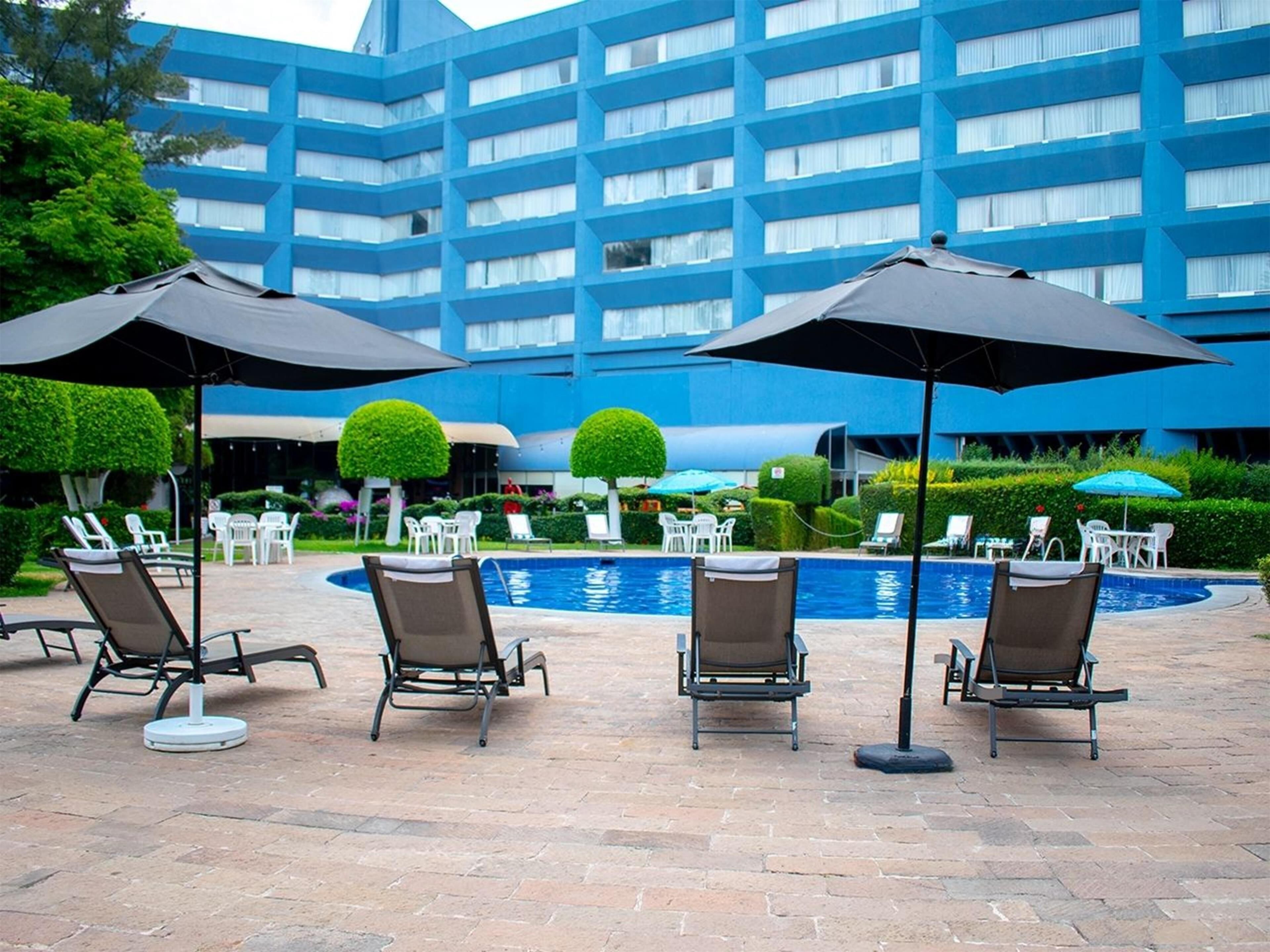 outdoor pool, pool umbrellas, pool loungers