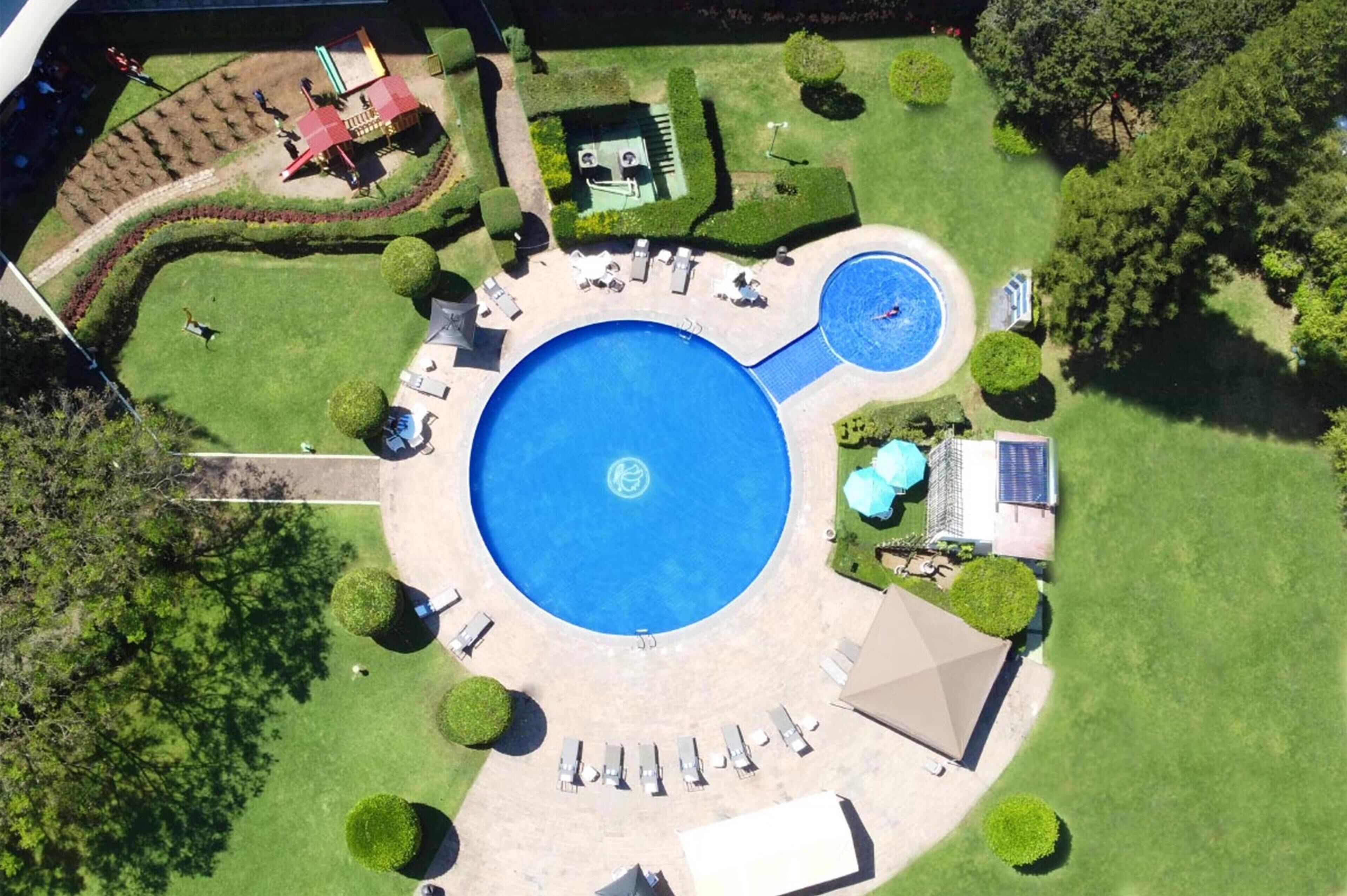 Outdoor pool, pool umbrellas, pool loungers