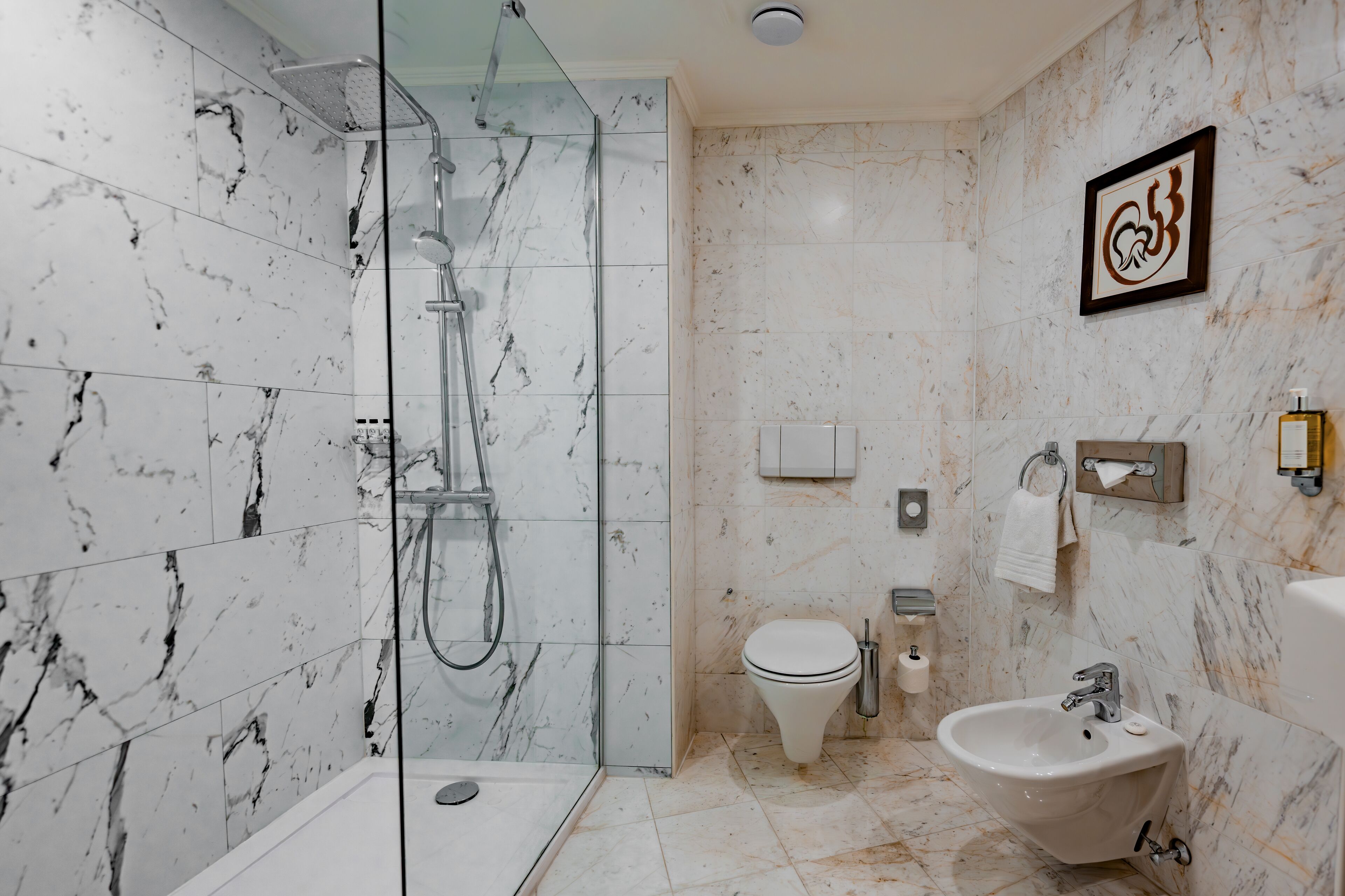 designer toiletries, hair dryer, towels, soap