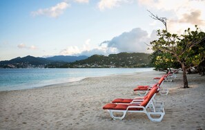 On the beach, sun loungers, beach umbrellas, beach towels