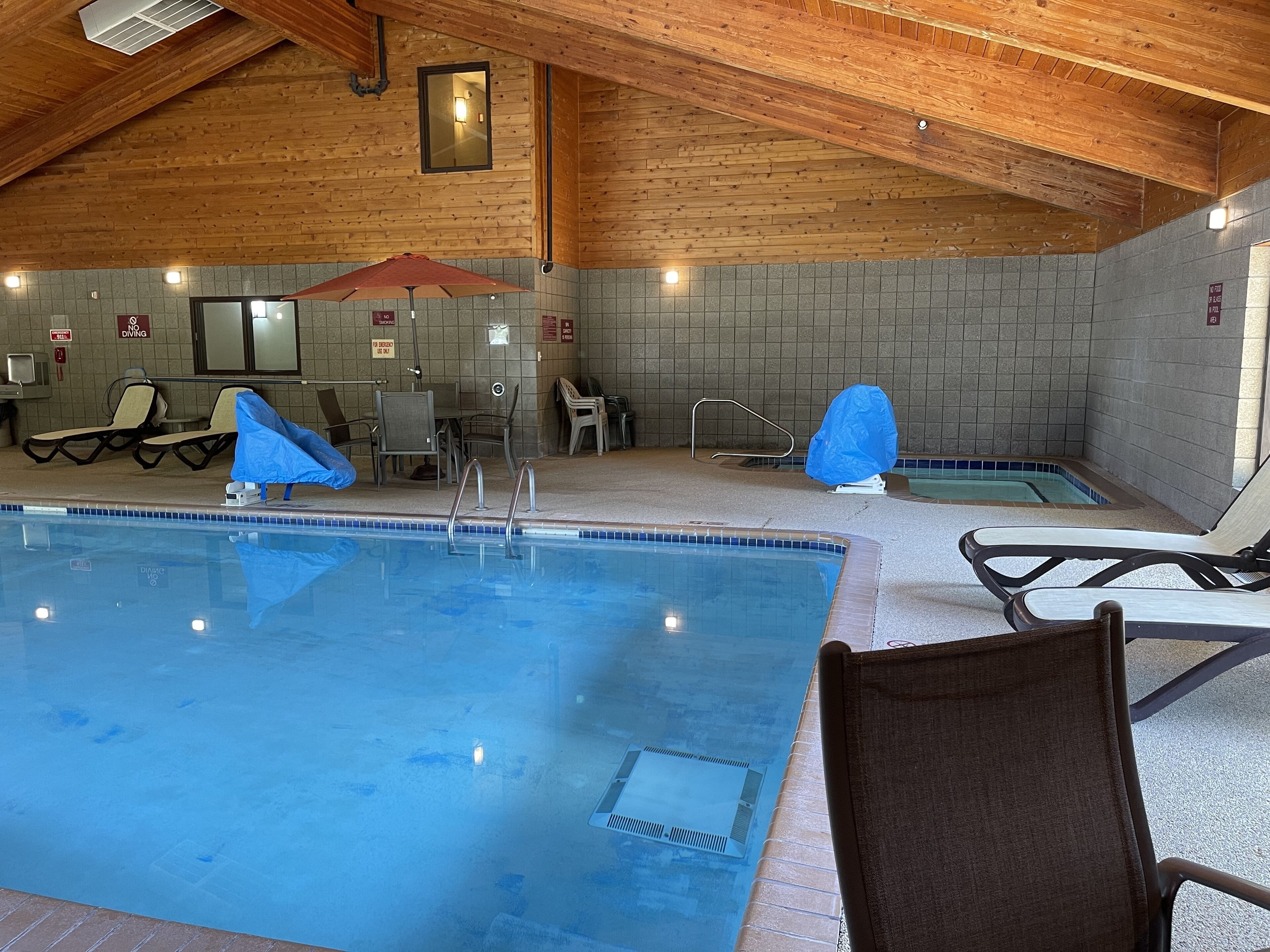 indoor pool, open 7:00 am to midnight, pool umbrellas, pool loungers