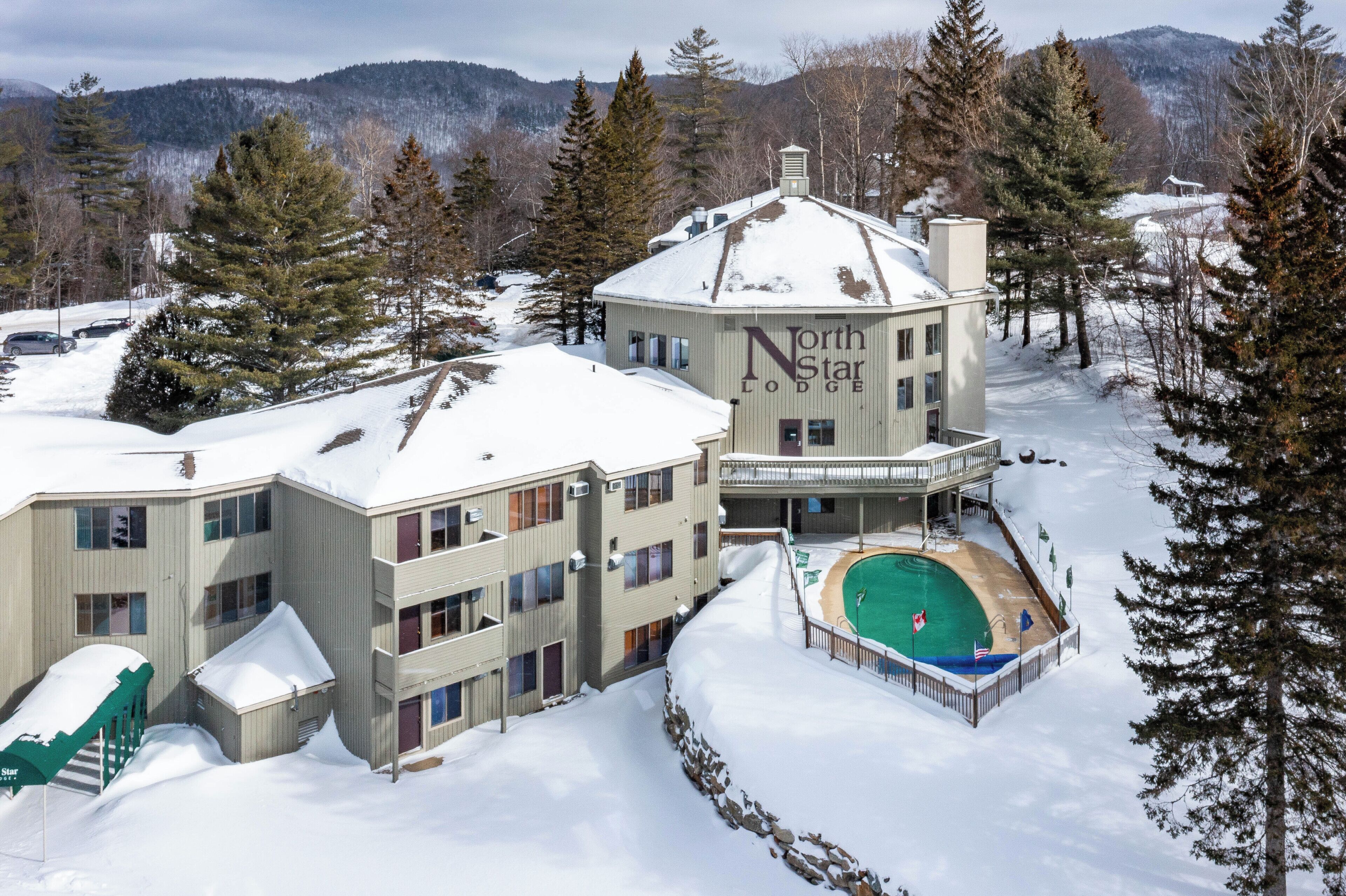 Outdoor pool, a heated pool, open 10:00 AM to 10:00 PM, pool umbrellas