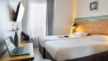 Premium bedding, desk, blackout drapes, soundproofing