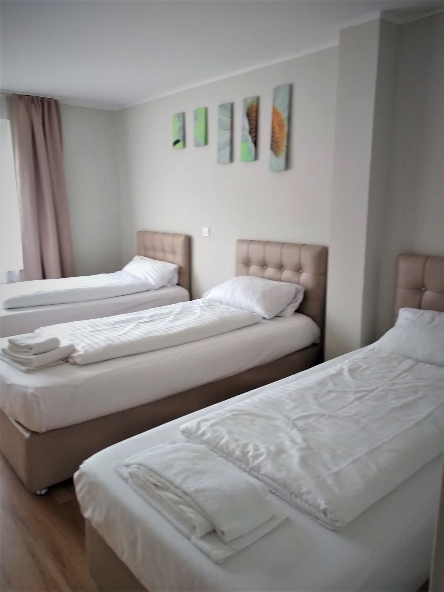 business quadruple room | premium bedding, desk, free wifi, bed sheets