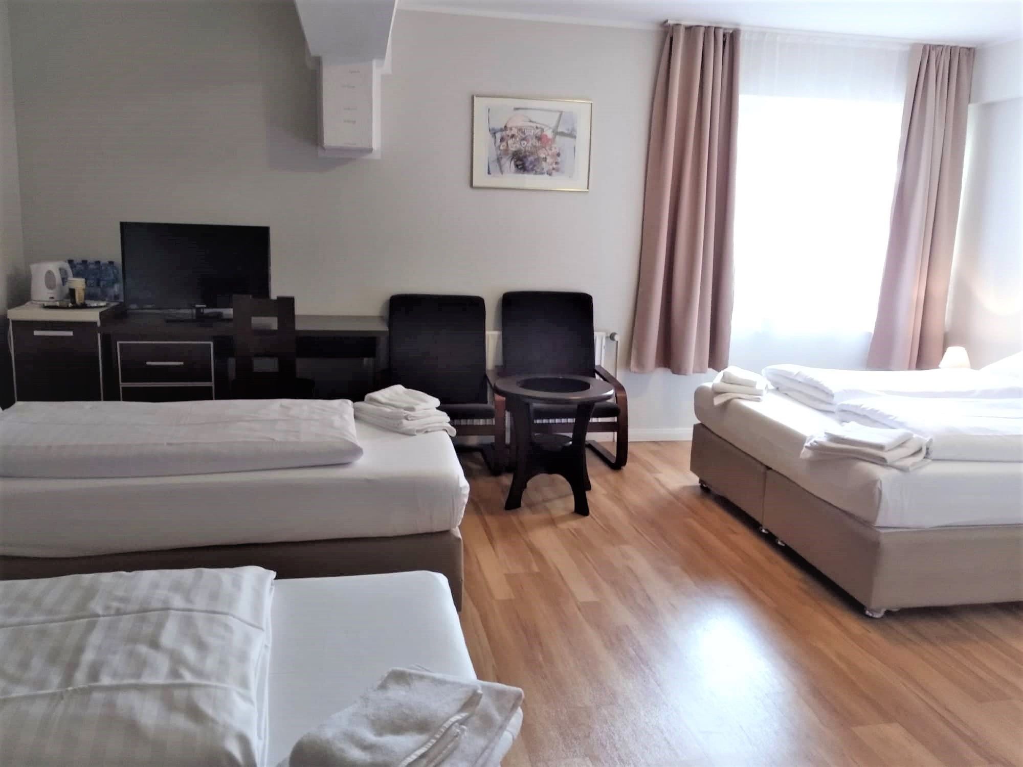 business quadruple room | premium bedding, desk, free wifi, bed sheets