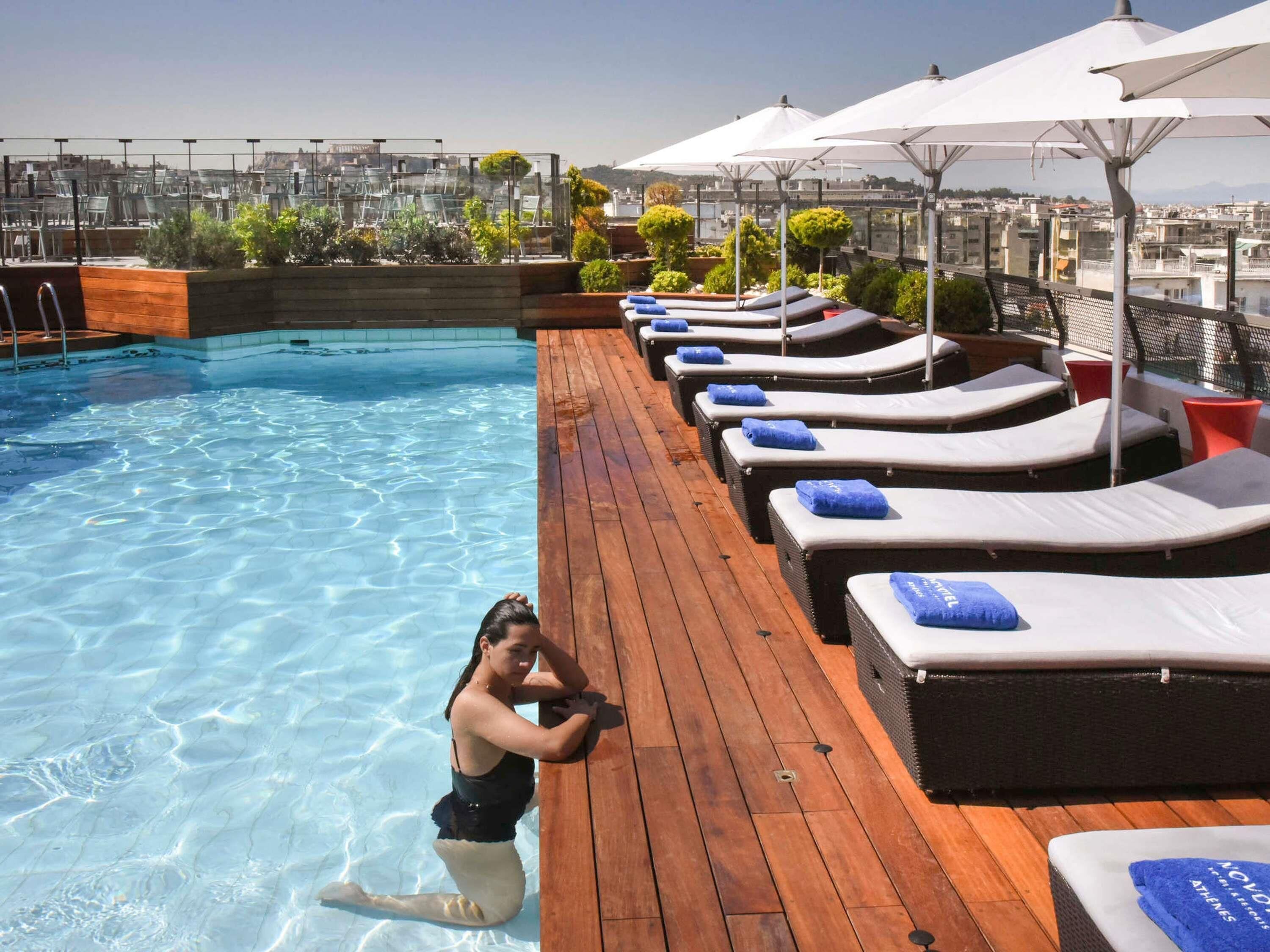Seasonal outdoor pool, open 10:00 AM to 7:00 PM, pool umbrellas