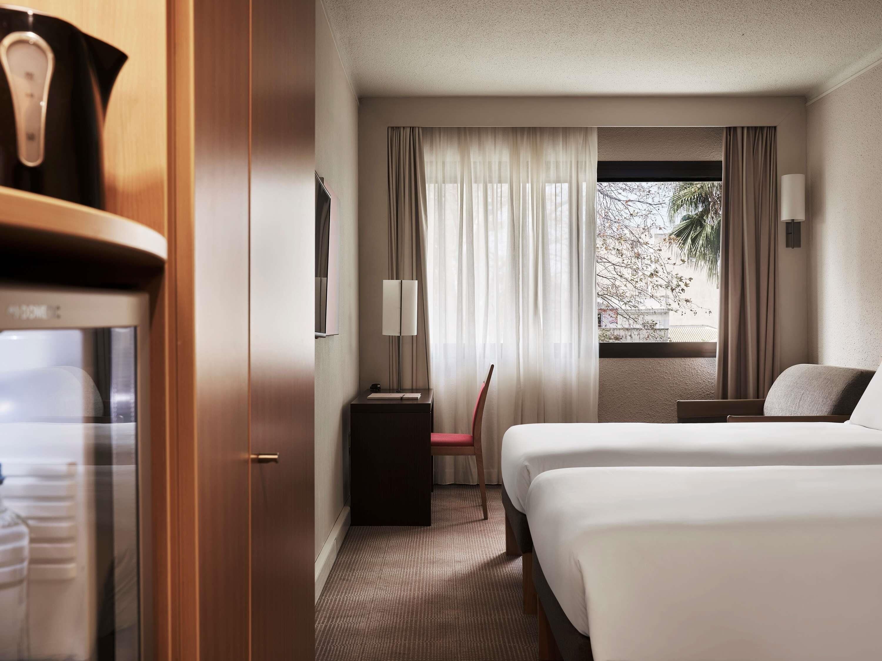 Standard Twin Room, 2 Single Beds and 1 Single Sofa Bed | Minibar, in-room safe, desk, blackout curtains