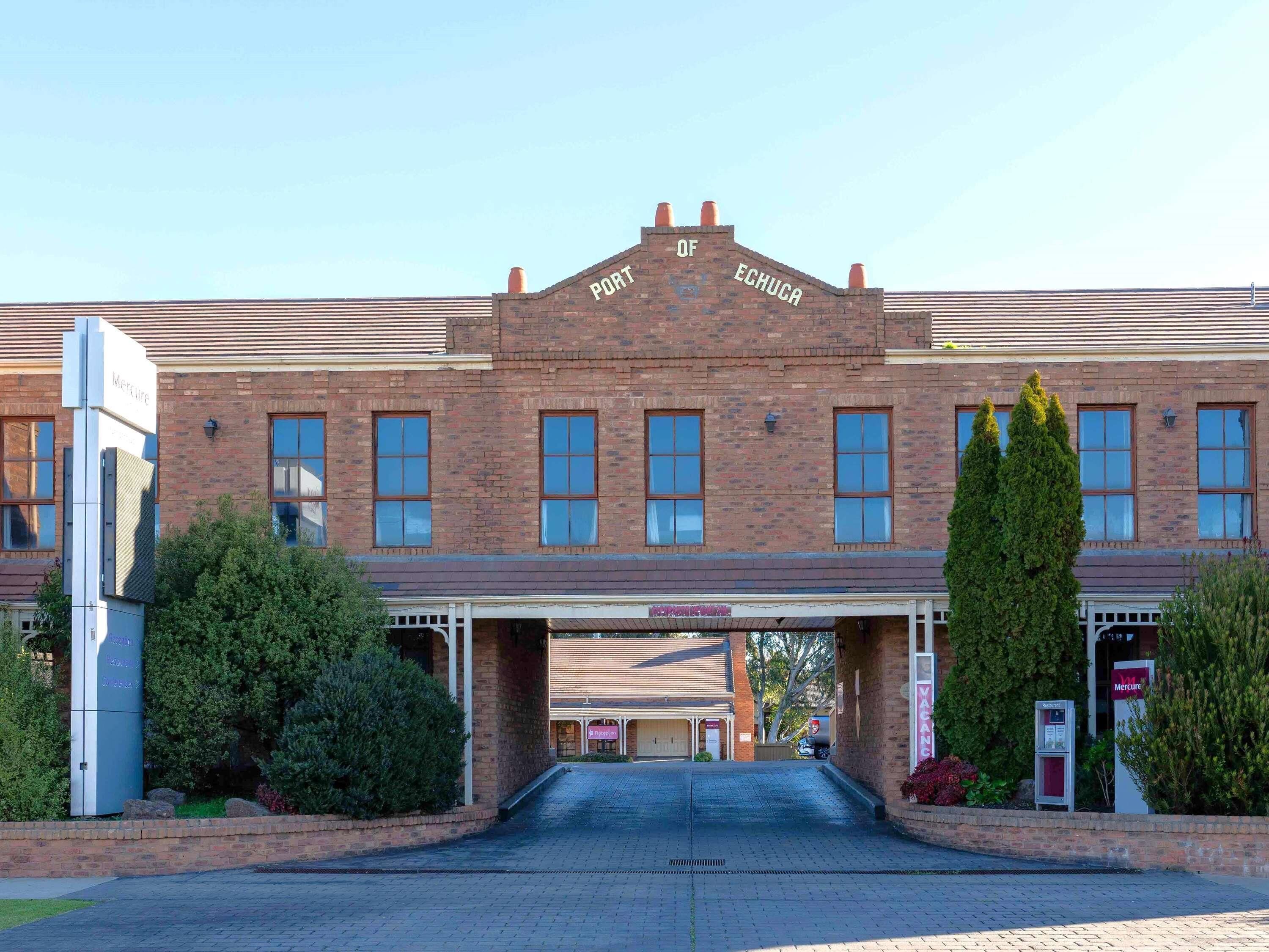 A brick building with a sign reading 'Port of Echuca' and a covered entrance.