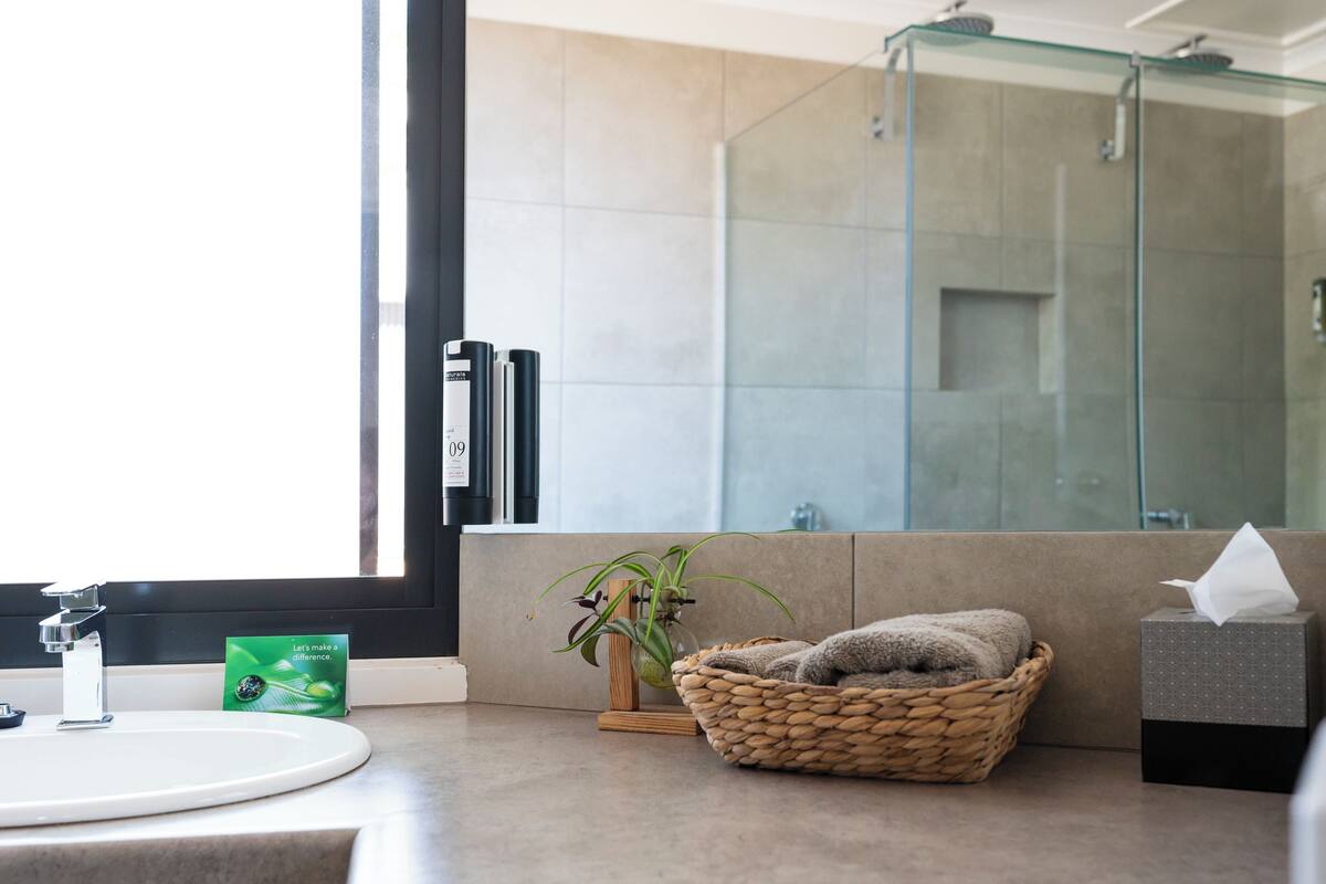 shower, eco-friendly toiletries, hair dryer, towels