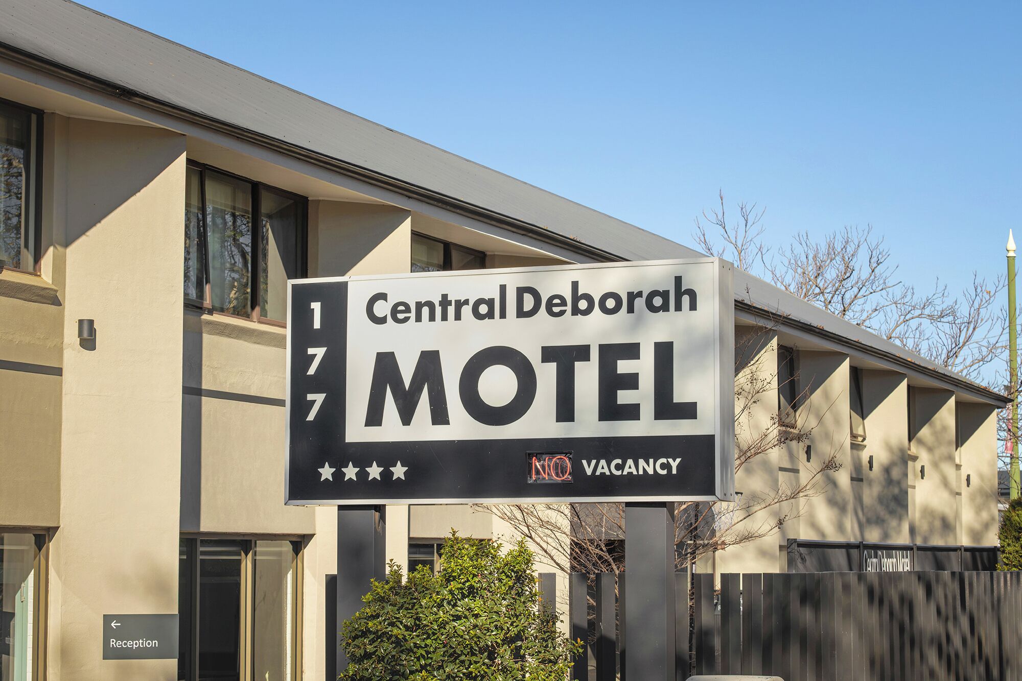 A sign for the Central Deborah Motel with a 'NO VACANCY' message.