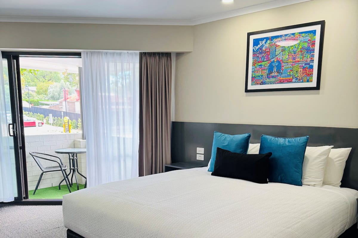 King Room with Balcony | Down comforters, individually decorated, individually furnished