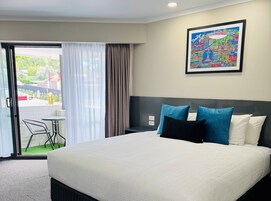 King Room with Balcony | Down comforters, individually decorated, individually furnished