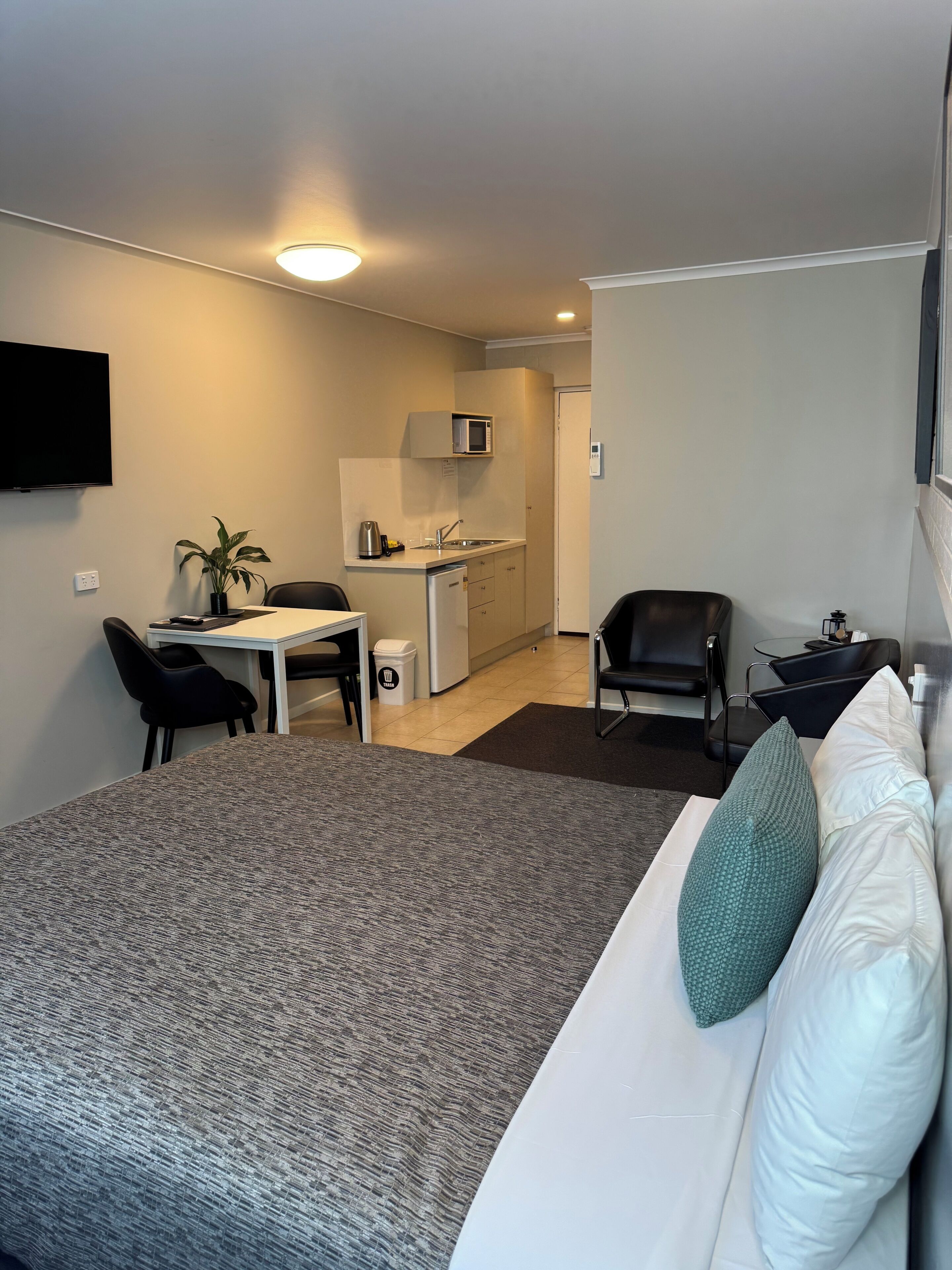 Queen Room with Kitchenette | Down comforters, individually decorated, individually furnished