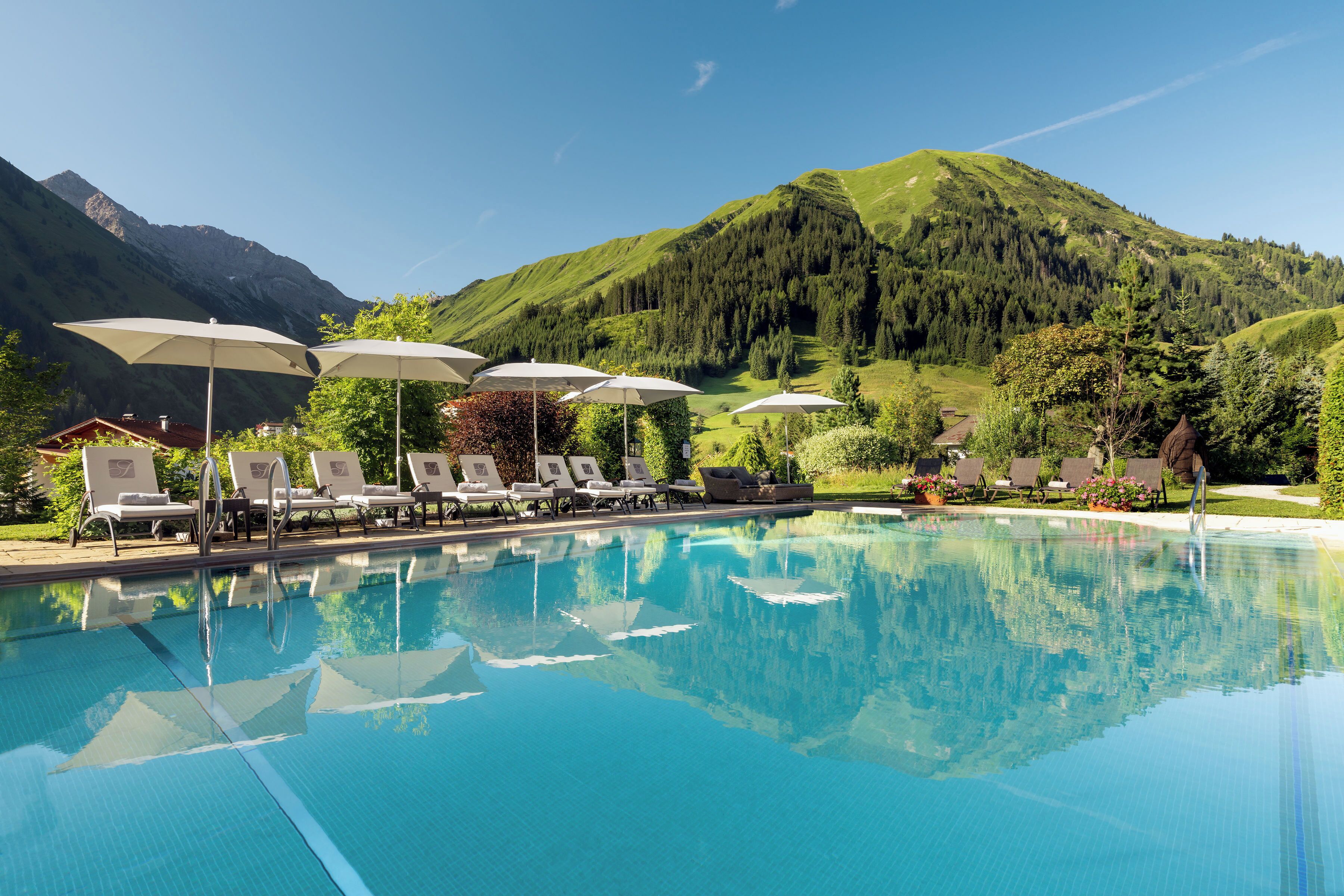 indoor pool, outdoor pool, pool umbrellas, pool loungers