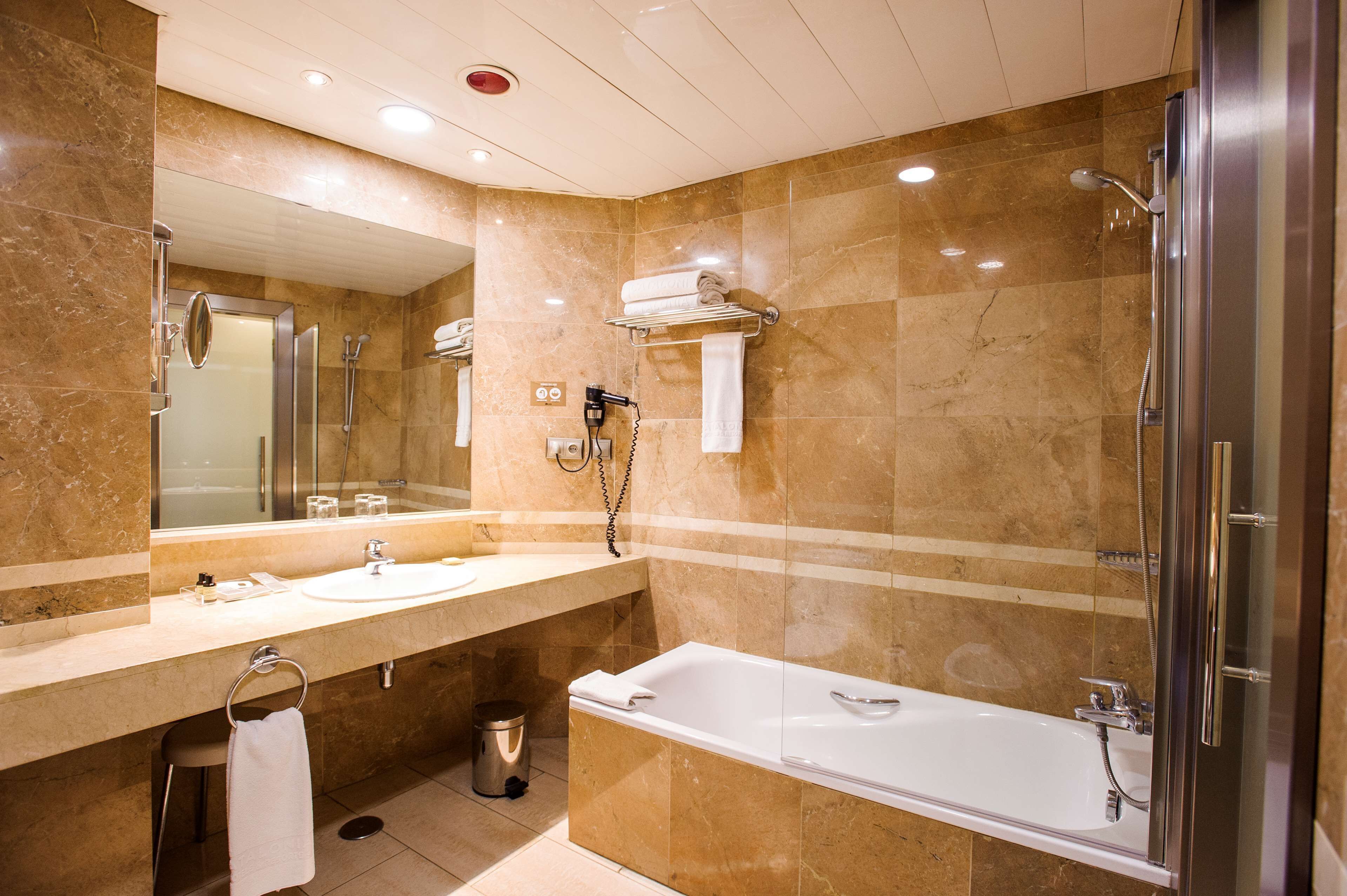 eco-friendly toiletries, hair dryer, bidet, towels