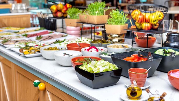 A buffet with various dishes and drinks, including salads, fruits, and beverages. - ibis Styles Szczecin Stare Miasto (Szczecin)