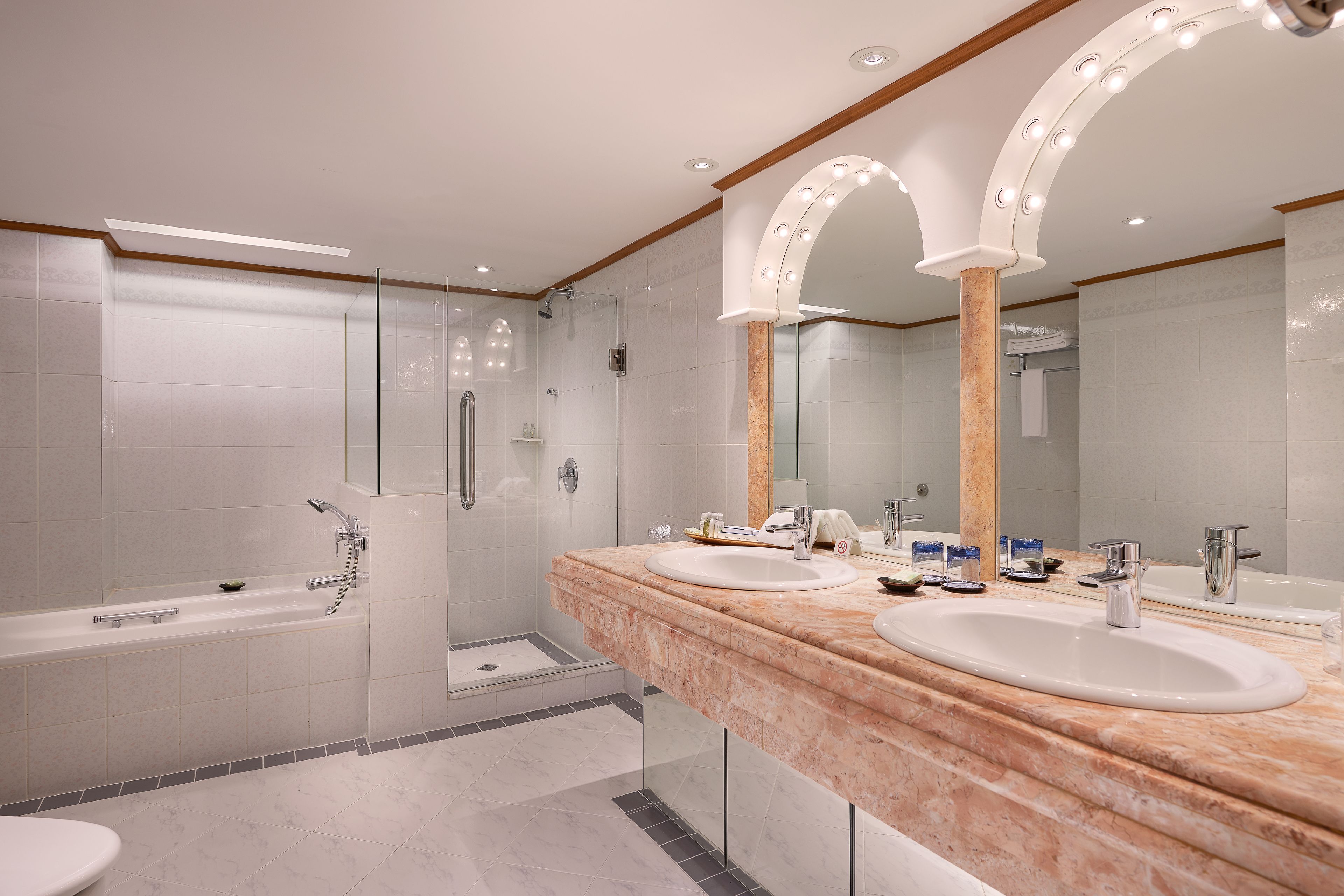 deluxe suite | bathroom | designer toiletries, hair dryer, bathrobes, slippers